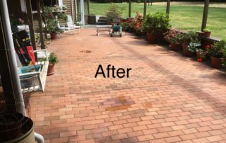 clean backyard patio following power washing by professional cleaning service