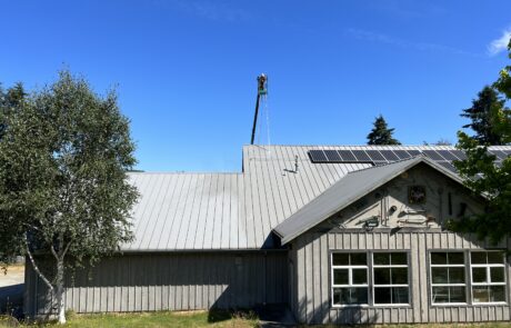 Commercial roof in Washington state being professionally cleaned by local roofers